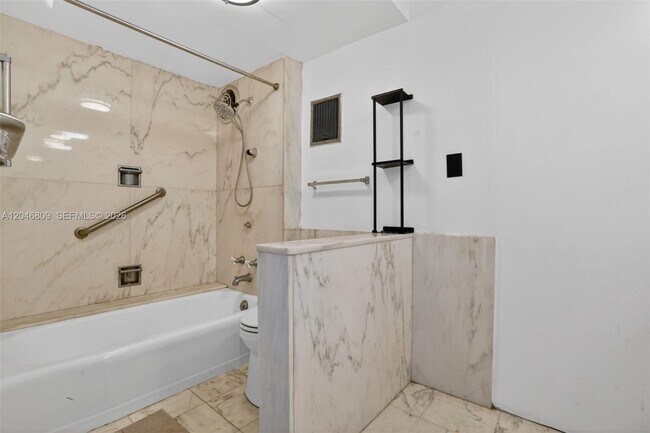 Building Photo - 10240 Collins Ave