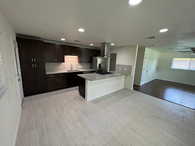 Entry into kitchen from the breezeway. - 6015 Heffernan St
