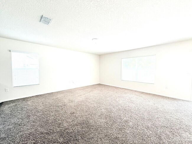 Building Photo - Spacious 4BR Home with Large Fenced Yard & Community Pool