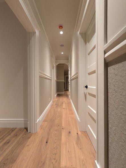 The main hallway in the evening, demonstrating the coziness of the dim-to-warm evening lighting - 328 Lexington St