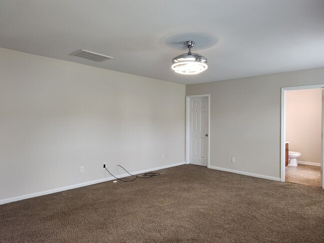 Building Photo - Pristine home located in the Woodbury comm...