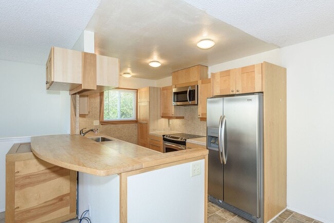 Building Photo - Serenity Abounds in University City!