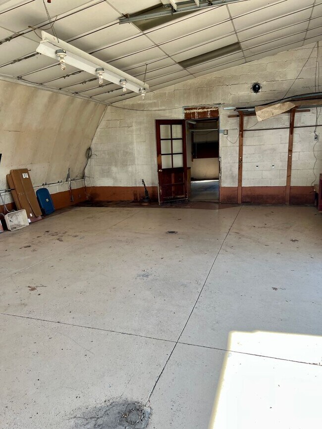 Building Photo - Country living! 1st floor laundry 3+ car garage with work shop