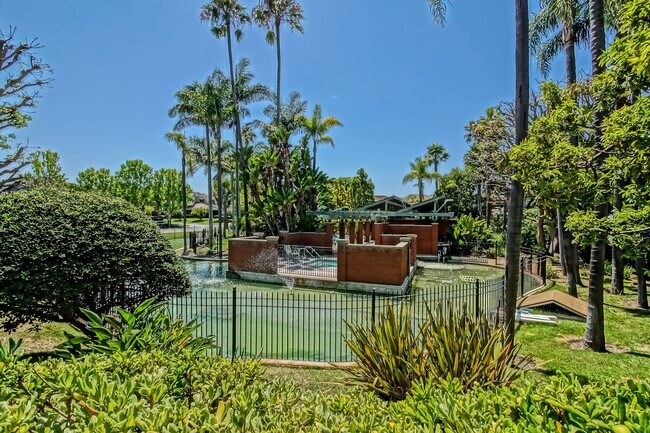Building Photo - PRIME POOLFRONT LOCATION & CLOSE TO MAIN GATE! BRIGHT & SPACIOUS, END-UNIT POOLFRONT TOWNHOUSE W/...