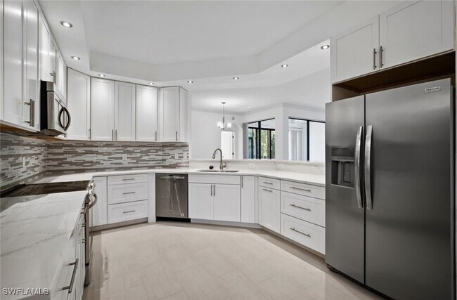 Building Photo - 7056 Pelican Bay Blvd