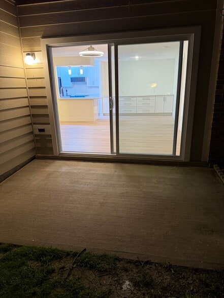 Patio allows entry directly into unit with key - 120 Creekwood Dr