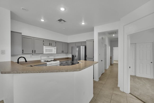 Building Photo - Beautiful 3-bedroom, 2-bathroom condo located in the gated community of The Legends, just minutes...