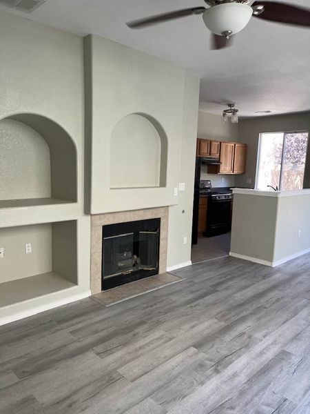Livingroom with auto fireplace and niches. - 6501 San Antonio Dr NE