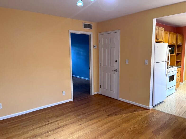 Living/Dining room facing entry and bedroom doors - 4285 Burton Rd