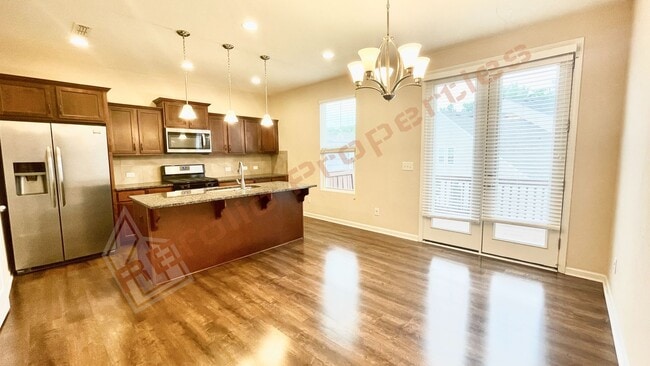 Building Photo - 3 Story Townhome 3 Bedrooms Rear Entry 2 Car Attached Garage with 1st Floor Bedroom, Community Po...