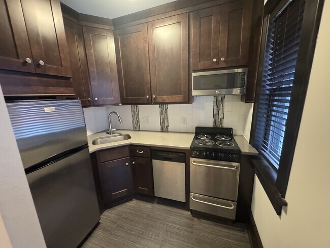 Building Photo - "Charming Studio Retreat with Hardwood Elegance in Downtown Minneapolis!"