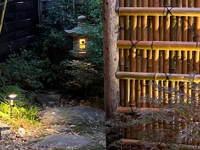 Stone lantern in the tea garden is lit with a flick of a switch in the home. - 73 Swannanoa Ave