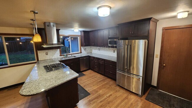 Building Photo - 3 bd 2ba Ranch Style Home with Fenced Yard, W/D in Unit, Fireplaces & 2 Car Garage!