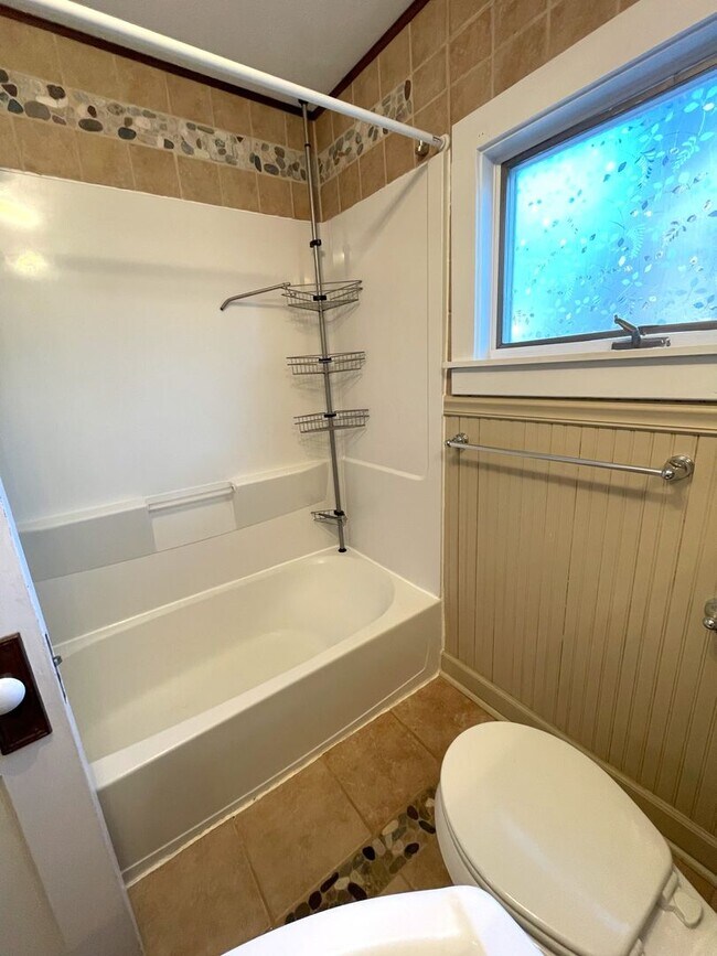 Building Photo - Spacious 3-Bedroom with Finished Basement | Parking, Laundry, & Private Backyard
