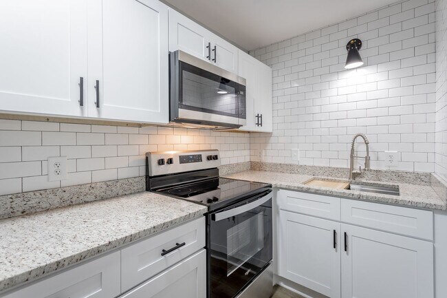 Building Photo - Discover Modern Living at Genesis Apartmen...
