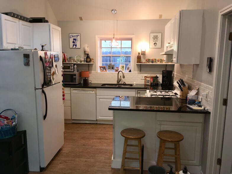 Kitchen with granite counters and gas stove and dishwasher. - 4302 Duval Street