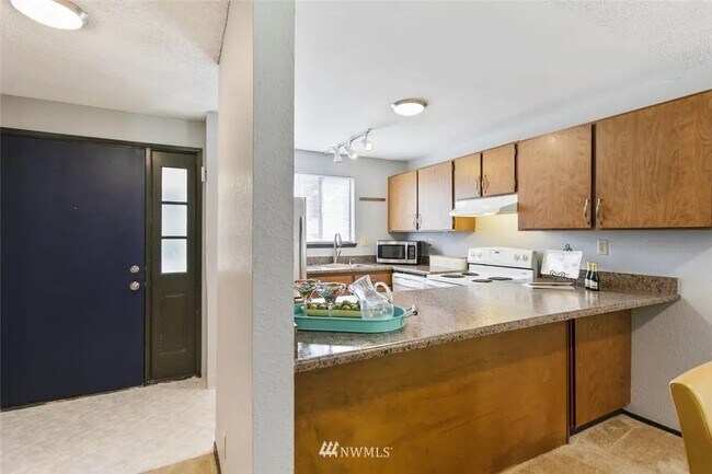 Kitchen has been updated with white paint - 8017 196th St SW