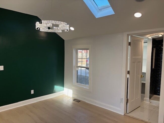 Building Photo - Step into modern luxury right here in Bloo...