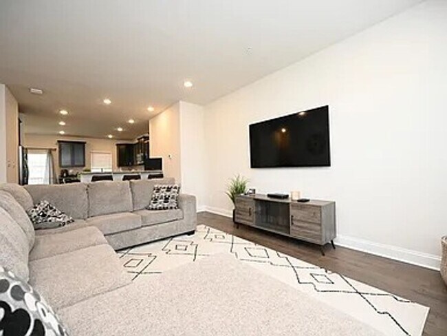 Building Photo - Stunning 3-Story Brick-Front Townhome | Modern Living + Military & First Responder Discount