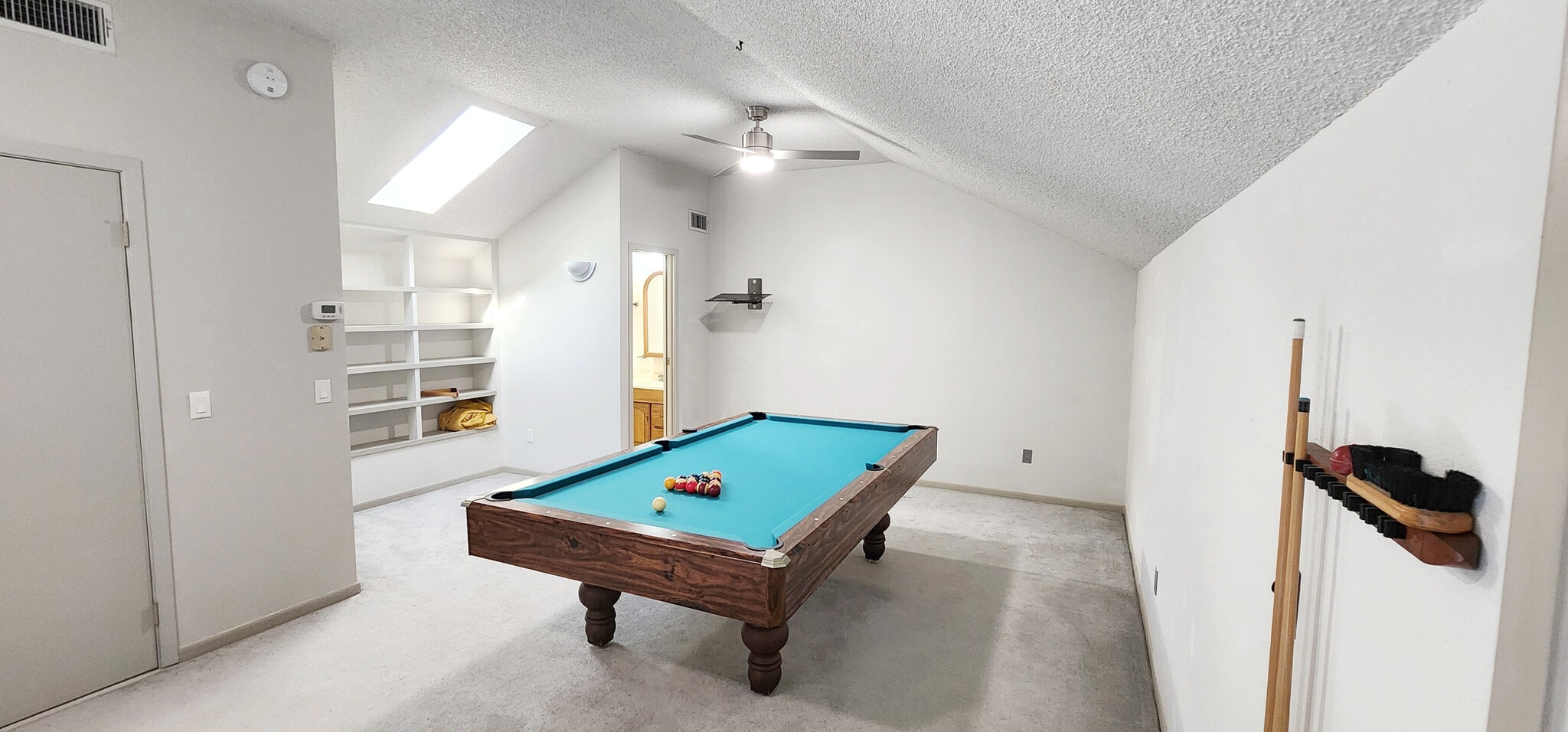 Spacious loft with pool table, skylight, bathroom, and bookshelf - 4722 Rainbow Run