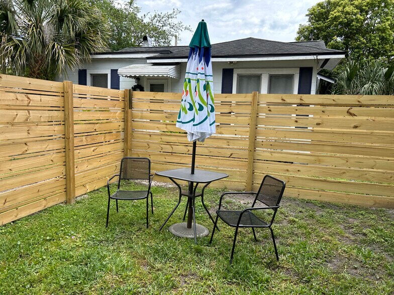 Fenced Yard. Dog door at bottom of stairs leads to fenced yard. - 1636 Larue Ave