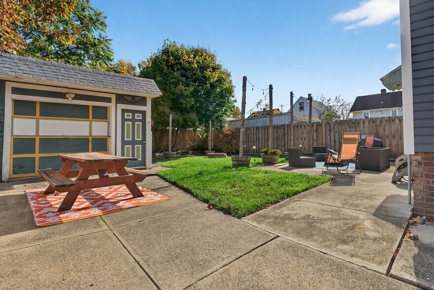Backyard with Fenced in Yard and String Lights - 4429 S Hills Dr