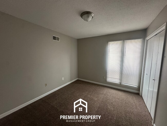 Building Photo - Charming 3BR Memphis Home | Rustic Brick Fireplace, Formal Dining & Fenced Backyard