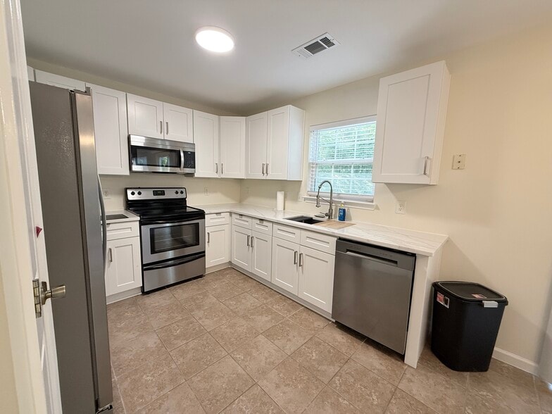 Kitchen with stainless steel appliances - 8253 Belmont Stables Dr