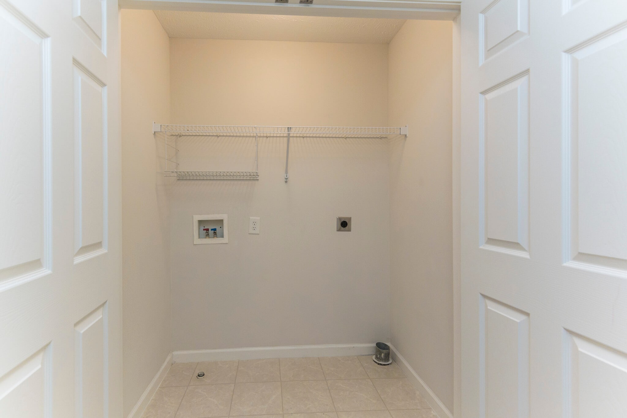 Laundry hookups centrally located between the upstairs bedrooms - 8725 Ambonnay Dr