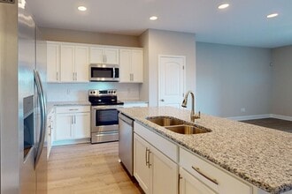 Building Photo - 11 @ Main Townhome Community