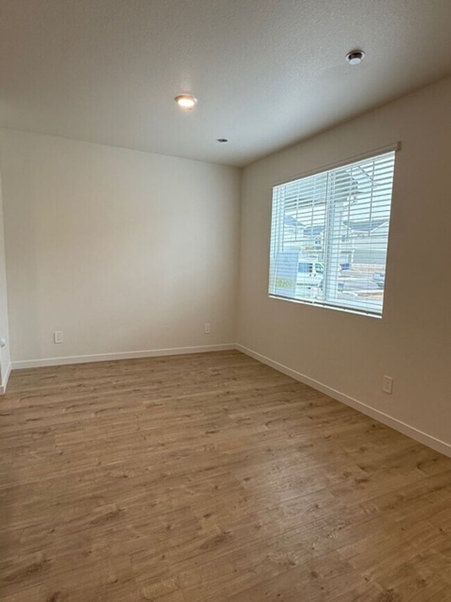 Building Photo - New 2 Bedroom Townhome + 2 Car Garage