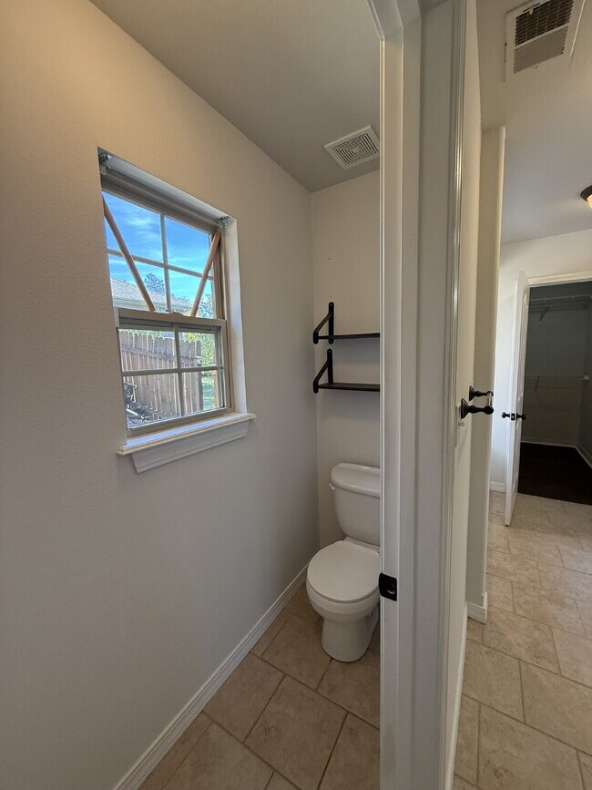 Building Photo - Spacious 3 BR with a fenced in backyard