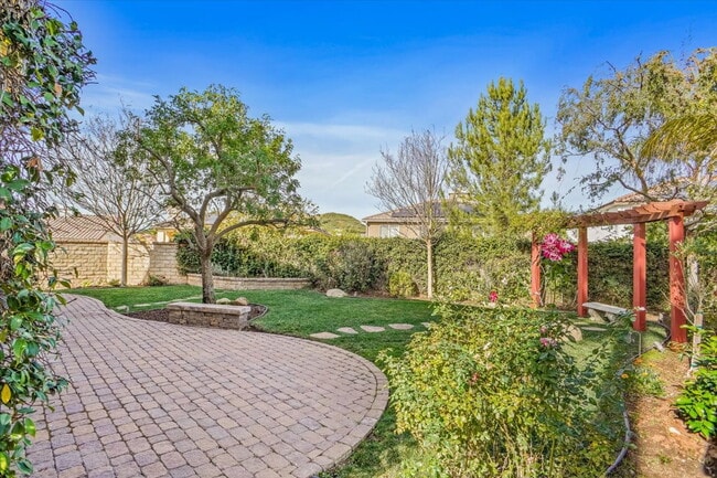 Building Photo - "Spacious 4-Bedroom Retreat with Cozy Fire...