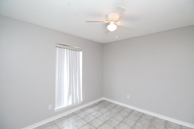 Building Photo - West Pensacola Brick Home with Vaulted Ceilings, Split Floor Plan, Open Living Design & Easy Acce...