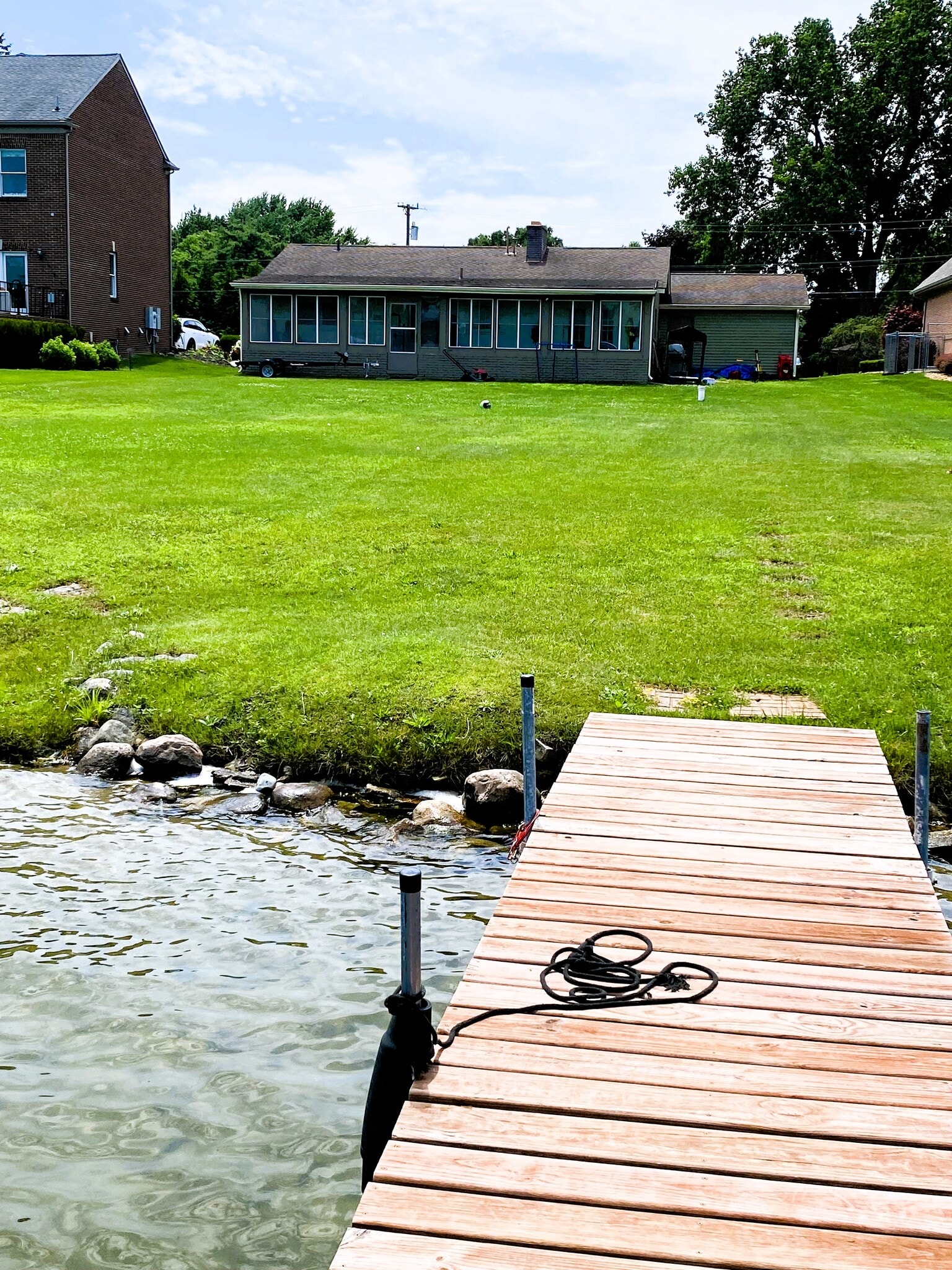 Standing on the dock facing the house. Sandy bottom, great for swimming! - 1611 Ludean Dr