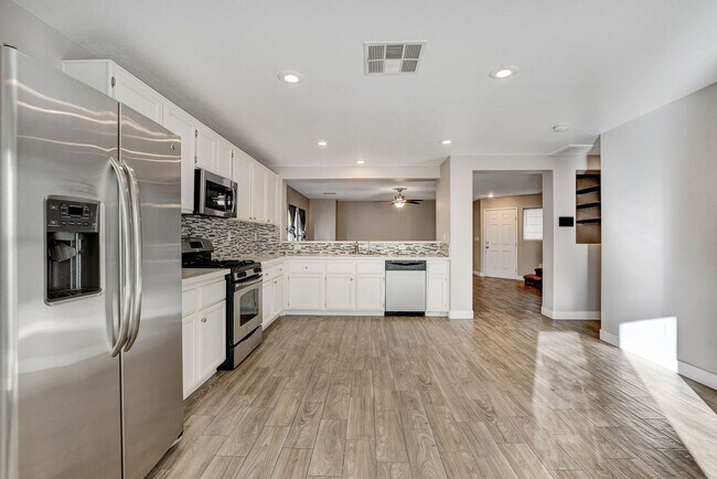 Building Photo - Totally Updated Solar Powered 4 Bedroom! Bedroom and Bath Downstairs!