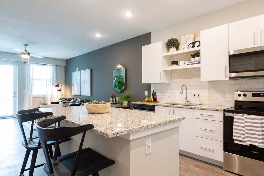 Gourmet kitchens include a Chef's island and pantry. - Windsor 335