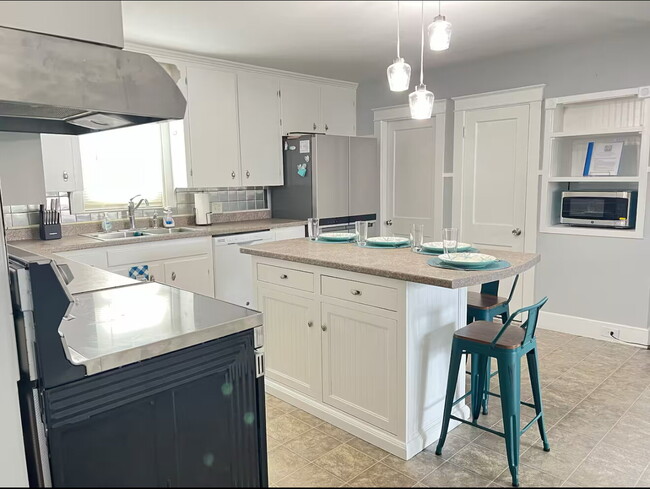 Building Photo - Coastal Charm Meets Comfort — Fully Furnis...