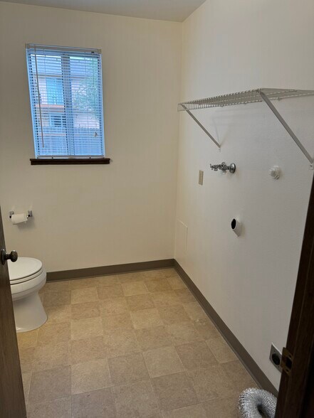 Downstairs 1/2 bath washer/ dryer hook up - 14618 SE 17th Cir