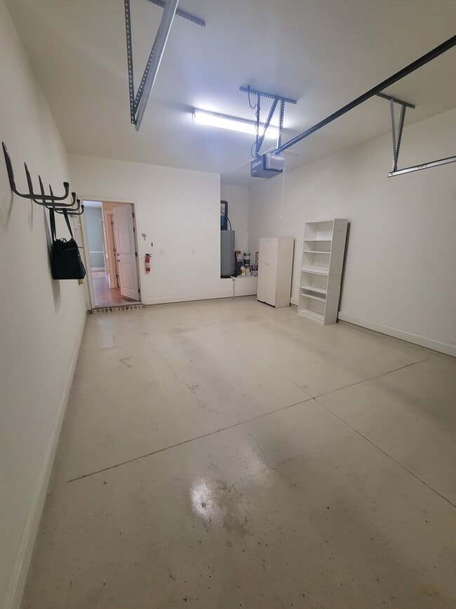 Building Photo - This 3 bedroom 2.5 bath brick townhouse with one car garage is located in Westgate Shoreline subd...