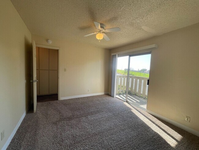 Building Photo - Downstairs 1-Bedroom Apartment, Private Patio, New Carpet & On-Site Laundry