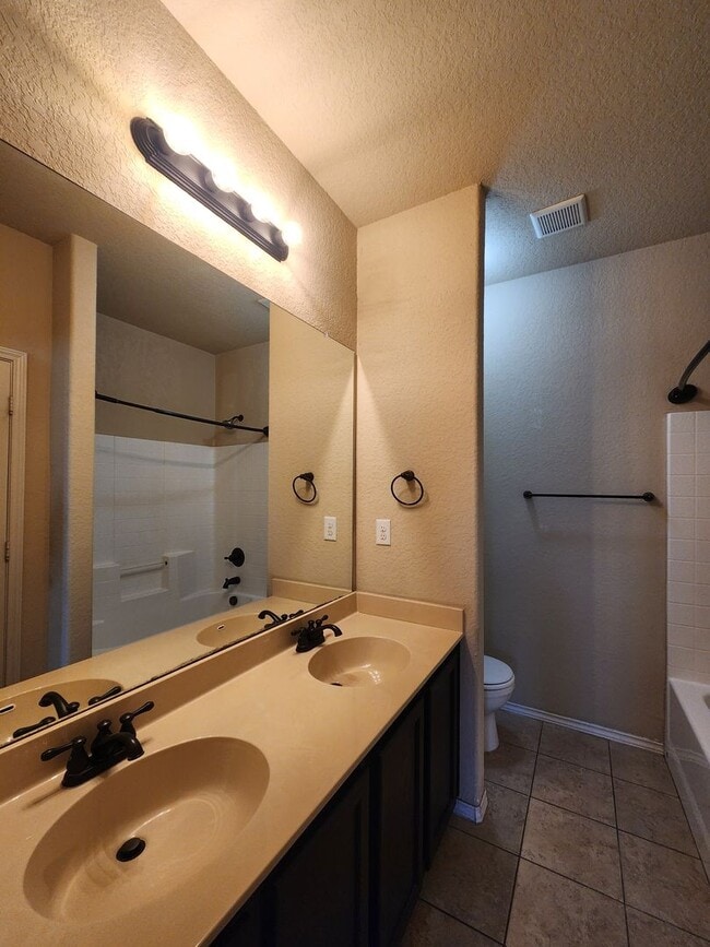 Building Photo - Wood Like Tile Flooring & Vinyl Plank - No Carpet / 1 Story Unit/ Fenced in Yard / Interior Washe...