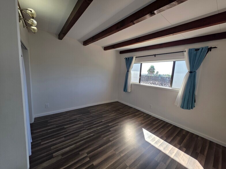 Bedroom 1 looks out over valley a bit, also with colorful sunsets. - 456 E Indian Rock Rd