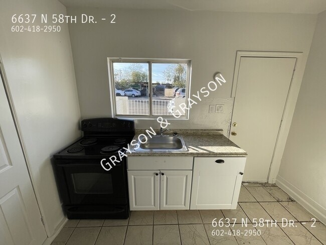 Building Photo - 6637 N 58th Dr