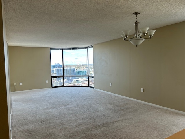 Spacious living room with floor to ceiling bay window - 1625 Larimer St