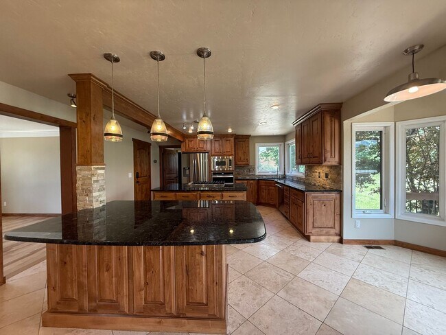 Building Photo - 5BD/4BA/3 car garage w Flat Yard Cheyenne ...