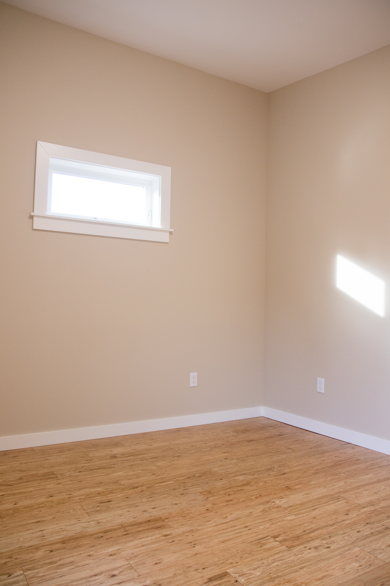 Bedroom window provides light but maintains privacy. - 5239 NE Mason St