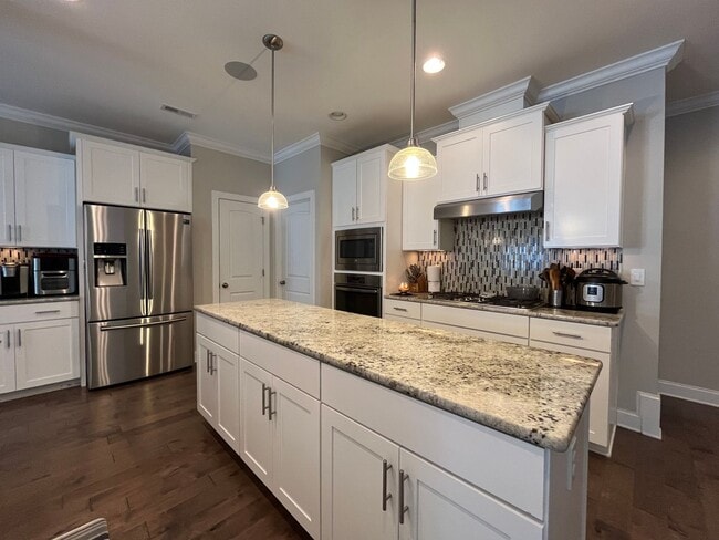 Building Photo - Exceptional 4BD, 2.5BA Cary Townhome with 2-Car Garage, Bonus 2nd Floor Living Space, and Private...