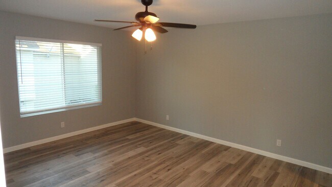 Building Photo - REMODELED 2BR; 1BA end unit condo w/ 1 car garage & 1 parking space