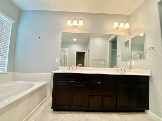 Building Photo - ALMOST NEW, UNIQUE 4 BEDROOM, 3 BATH, 2 CA...
